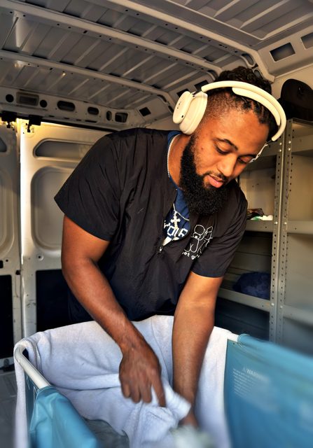 Towel work inside the mobile grooming van